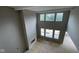 Spacious living room with soaring ceilings, ample natural light from large windows, and a cozy fireplace at 1919 Delp Ct, Avon, IN 46123