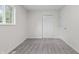 Bright bedroom showcasing neutral paint, new carpet, and a double door closet at 1948 Bloyd Ave, Indianapolis, IN 46218