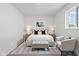 A well-lit bedroom features neutral tones, a plush bed, and stylish decor at 1948 Bloyd Ave, Indianapolis, IN 46218