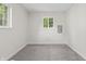 Neutral bedroom has new carpet, a small window and an electrical panel at 1948 Bloyd Ave, Indianapolis, IN 46218