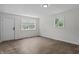 Bedroom showcasing hardwood floors, fresh white paint, and lots of natural light at 1948 Bloyd Ave, Indianapolis, IN 46218