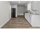 Open kitchen area with modern appliances, including a dishwasher, stove, and refrigerator at 1948 Bloyd Ave, Indianapolis, IN 46218