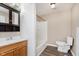 Bathroom featuring tiled floors, a vanity with storage, mirror, and bathtub at 2925 E 8Th St, Anderson, IN 46012