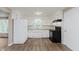 Clean kitchen features white cabinets, modern black appliances, and wood countertop at 2925 E 8Th St, Anderson, IN 46012