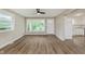 Bright living room with hardwood floors, large windows, and neutral paint at 2925 E 8Th St, Anderson, IN 46012