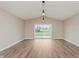 Spacious living room with hardwood floors, vaulted ceilings, and ample natural light at 2925 E 8Th St, Anderson, IN 46012