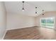 Vaulted ceiling, spacious living area with sliding glass doors to the outside at 2925 E 8Th St, Anderson, IN 46012