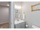 Bright bathroom featuring a modern vanity with a sink, decorative mirror, and stylish accessories at 3011 N New Jersey St, Indianapolis, IN 46205