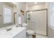 Modern bathroom with a glass-enclosed shower, white subway tiles, and contemporary fixtures at 3011 N New Jersey St, Indianapolis, IN 46205