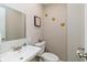 Bathroom featuring a white vanity, decorative mirror, and modern fixtures, offering a clean and stylish space at 3011 N New Jersey St, Indianapolis, IN 46205