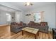 Spacious living room with wood-look floors, ceiling fan, and an open layout, perfect for entertaining at 3011 N New Jersey St, Indianapolis, IN 46205