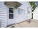 Functional back entrance of this house features durable siding, a convenient door, and direct outdoor access at 307 E 5Th St, Sheridan, IN 46069