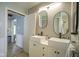 Bright bathroom with double vanity sinks and minimalist mirrors provides ample space and style for daily routines at 307 E 5Th St, Sheridan, IN 46069