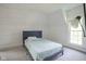 Bedroom showcasing carpet, one full bed, an accent wall, and a bright window at 307 E 5Th St, Sheridan, IN 46069