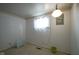 Neutral bedroom with light carpet, heater, simple decor, and a window for ample natural light at 307 E 5Th St, Sheridan, IN 46069