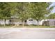 Charming home features a quaint porch, trees, and a serene setting for relaxation and curb appeal at 307 E 5Th St, Sheridan, IN 46069