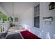 View of the home's porch that features durable rugs, ample space, and protective railings at 307 E 5Th St, Sheridan, IN 46069