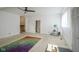 Spacious room with carpet, bright light, and a colorful rug at 307 E 5Th St, Sheridan, IN 46069