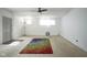 Inviting living room featuring a ceiling fan, carpet, bright light, and a colorful rug at 307 E 5Th St, Sheridan, IN 46069