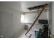 Versatile space features a functional ladder, overhead lighting, storage, and durable flooring ready for customization at 307 E 5Th St, Sheridan, IN 46069