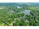Picturesque aerial view of a lakefront community surrounded by lush forests and scenic landscapes at 3695 Windsor Pl, Martinsville, IN 46151