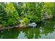 Scenic aerial view of lakefront property with lush greenery and boat dock at 3695 Windsor Pl, Martinsville, IN 46151