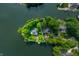 Stunning aerial view of waterfront homes surrounded by lush greenery on a private peninsula with property lines outlined at 3695 Windsor Pl, Martinsville, IN 46151