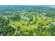 Expansive aerial view of a golf course community with winding fairways and lush green landscaping at 3695 Windsor Pl, Martinsville, IN 46151