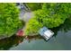 Lush lakefront property with private beach, boat dock and scenic views at 3695 Windsor Pl, Martinsville, IN 46151