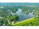Scenic aerial view of a lake community surrounded by lush green trees at 3695 Windsor Pl, Martinsville, IN 46151
