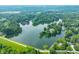 Picturesque aerial view of a lakefront community surrounded by lush forests and scenic landscapes at 3695 Windsor Pl, Martinsville, IN 46151