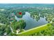 Aerial view featuring a pin location on a lake home with boat dock surrounded by lush trees at 3695 Windsor Pl, Martinsville, IN 46151
