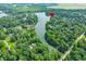 Picturesque aerial view of a lakefront community surrounded by lush forests and scenic landscapes at 3695 Windsor Pl, Martinsville, IN 46151
