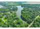 Picturesque aerial view of a lakefront community surrounded by lush forests and scenic landscapes at 3695 Windsor Pl, Martinsville, IN 46151