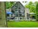 Spacious backyard with manicured lawn and inviting deck featuring seating and dining areas at 3695 Windsor Pl, Martinsville, IN 46151