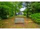 Tranquil backyard featuring a bench, and views of the home framed by mature trees at 3695 Windsor Pl, Martinsville, IN 46151