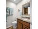 Well-lit bathroom featuring a granite vanity, framed mirror, and updated fixtures at 3695 Windsor Pl, Martinsville, IN 46151