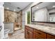 Bathroom showcases a granite countertop, wooden cabinets, and a tiled glass shower at 3695 Windsor Pl, Martinsville, IN 46151
