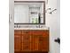 Bathroom boasts a wood vanity with double sinks, granite counters, and a large mirror for ample space at 3695 Windsor Pl, Martinsville, IN 46151