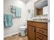 Well-lit bathroom featuring a granite vanity, framed mirror, and updated fixtures at 3695 Windsor Pl, Martinsville, IN 46151