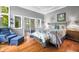 Relaxing bedroom with access to an outdoor patio, hardwood floors, and peaceful decor at 3695 Windsor Pl, Martinsville, IN 46151