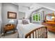 Bright bedroom featuring plush bedding, white carpet, neutral walls, and warm wood furniture at 3695 Windsor Pl, Martinsville, IN 46151