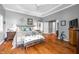 Inviting bedroom features hardwood floors, neutral colors, and great natural light at 3695 Windsor Pl, Martinsville, IN 46151