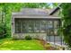 Exterior view of a well-maintained home with a stone facade, a covered porch, and lush landscaping at 3695 Windsor Pl, Martinsville, IN 46151