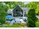 Stunning lake house featuring a large deck, floor to ceiling windows, and well-maintained landscaping at 3695 Windsor Pl, Martinsville, IN 46151