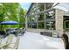 Exterior angle of the home showing the stone facade, many windows, and outdoor deck area at 3695 Windsor Pl, Martinsville, IN 46151