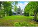 Beautiful lake house with expansive lawn, towering windows, and a spacious deck for outdoor enjoyment at 3695 Windsor Pl, Martinsville, IN 46151
