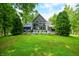 Beautiful lake house with a large deck and picturesque lawn at 3695 Windsor Pl, Martinsville, IN 46151