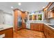 Bright kitchen with wood cabinetry, stainless steel appliances and granite countertops at 3695 Windsor Pl, Martinsville, IN 46151