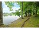Scenic lake view showcasing lush greenery and serene waters at 3695 Windsor Pl, Martinsville, IN 46151